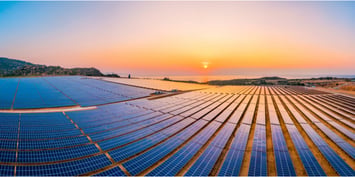 Solar energy in Asia showcased through a large solar farm at sunset, highlighting the growing solar energy market, new jobs and renewable energy projects.